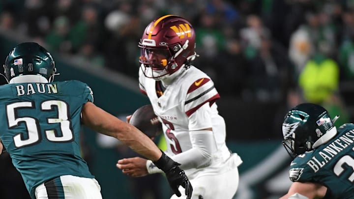 Nov 14, 2024; Philadelphia, Pennsylvania, USA; Washington Commanders quarterback Jayden Daniels (5) is chased boy Philadelphia Eagles linebacker Zack Baun (53) and safety Reed Blankenship (32) during the fourth quarter at Lincoln Financial Field. Mandatory Credit: Eric Hartline-Imagn Images Nov 14, 2024; Philadelphia, Pennsylvania, USA; Washington Commanders quarterback Jayden Daniels (5) is chased boy Philadelphia Eagles linebacker Zack Baun (53) and safety Reed Blankenship (32) during the fourth quarter at Lincoln Financial Field. Mandatory Credit: Eric Hartline-Imagn Images