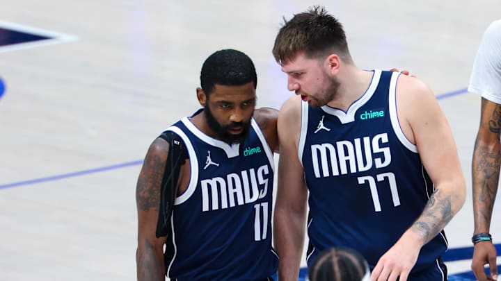 Jun 14, 2024; Dallas, Texas, USA; Dallas Mavericks guard Kyrie Irving (11) reacts with Dallas Mavericks guard Luka Doncic (77) during the second half against the Boston Celtics during game four of the 2024 NBA Finals at American Airlines Center. Mandatory Credit: Kevin Jairaj-Imagn Images