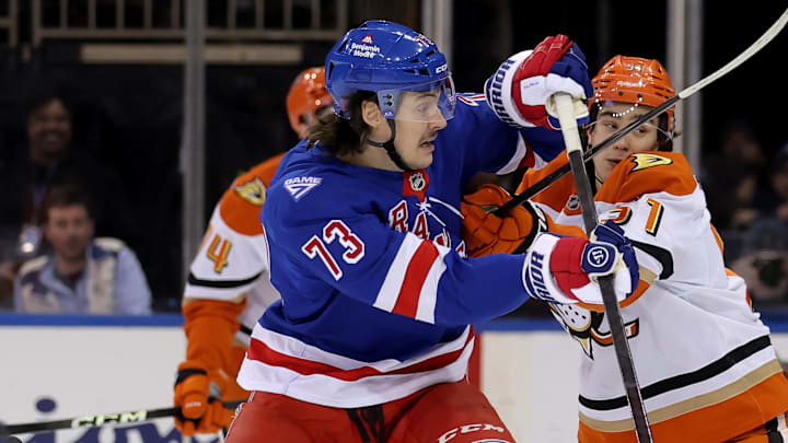 Dec 15, 2025; New York, New York, USA; New York Rangers center Matt Rempe (73) hits Anaheim Ducks defenseman Olen Zellweger (51) during the first period at Madison Square Garden. Mandatory Credit: Brad Penner-Imagn Images