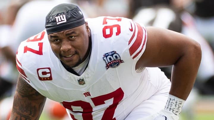Sep 22, 2024; Cleveland, Ohio, USA; New York Giants defensive tackle Dexter Lawrence II (97) stretches during warm ups before the game against the Cleveland Browns at Huntington Bank Field. Mandatory Credit: Scott Galvin-Imagn Images