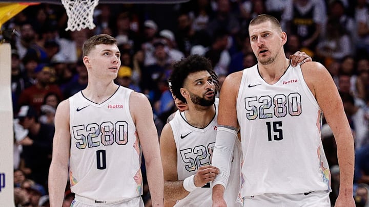 May 15, 2025; Denver, Colorado, USA; Denver Nuggets guard Jamal Murray (27) and center Nikola Jokic (15) and guard Christian Braun (0) in the fourth quarter against the Oklahoma City Thunder during game six of the second round for the 2025 NBA Playoffs at Ball Arena. Mandatory Credit: Isaiah J. Downing-Imagn Images