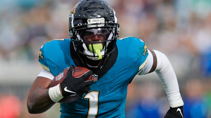 Jacksonville Jaguars running back Travis Etienne Jr. (1) rushes for yards during the second quarter Sunday, Dec. 15, 2024 at EverBank Stadium in Jacksonville, Fla. [Corey Perrine/Florida Times-Union]