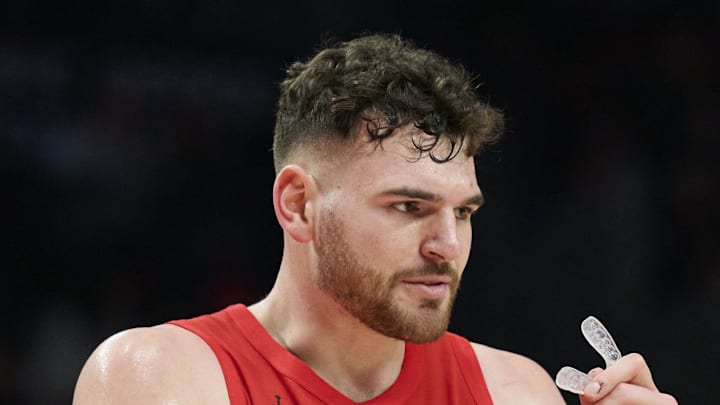 Portland Trail Blazers center Donovan Clingan high fives forward Deni Avdija.