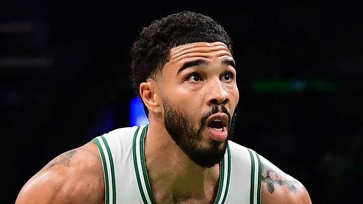 Oct 10, 2026; Boston, Massachusetts, USA;  Boston Celtics forward Jayson Tatum (0) controls the ball past Philadelphia 76ers forward Justin Edwards (11) during the second half at TD Garden. Mandatory Credit: Bob DeChiara-Imagn Images
