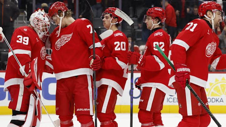 Nov 18, 2025; Detroit, Michigan, USA; Detroit Red Wings goaltender Cam Talbot (39) and defenseman Simon Edvinsson (77) celebrate defeating the Seattle Kraken at Little Caesars Arena. Mandatory Credit: Rick Osentoski-Imagn Images Nov 18, 2025; Detroit, Michigan, USA; Detroit Red Wings goaltender Cam Talbot (39) and defenseman Simon Edvinsson (77) celebrate defeating the Seattle Kraken at Little Caesars Arena. Mandatory Credit: Rick Osentoski-Imagn Images