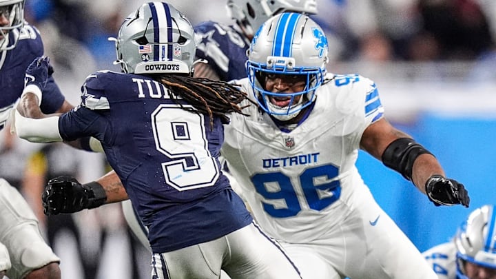 Detroit Lions linebacker Al-Quadin Muhammad (96) tackles Dallas Cowboys kick returner KaVontae Turpin (9) 