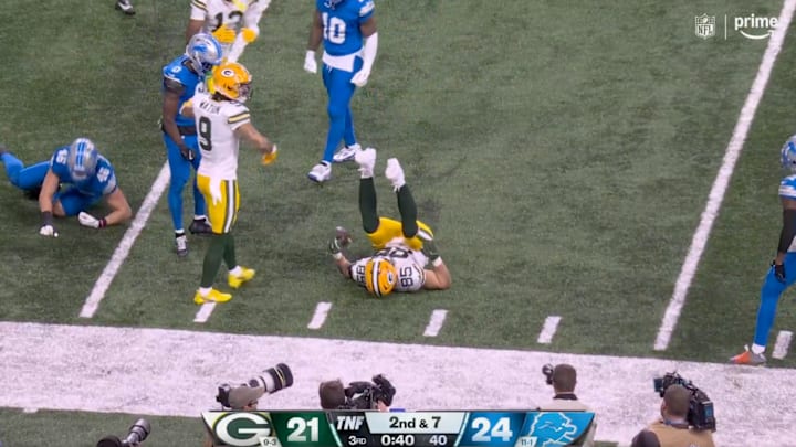 Green Bay Packers TE Tucker Kraft prepares to get up after a big hit vs. the Detroit Lions on Dec. 5, 2024.