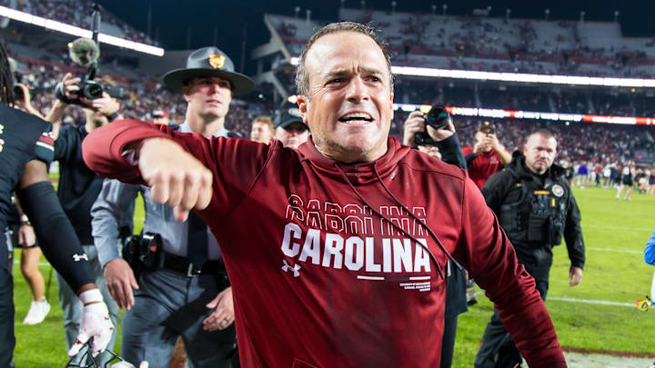 Nov 16, 2024; Columbia, South Carolina, USA; South Carolina Gamecocks head coach Shane Beamer celebrates beating the Missouri Tigers at Williams-Brice Stadium. He is holding the Mayors Cup, given to the winner of the South Carolina-Missouri game. Mandatory Credit: Jeff Blake-Imagn Images