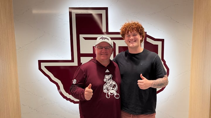 Asher Ghioto with Texas A&M Aggies Head Coach Mike Elko