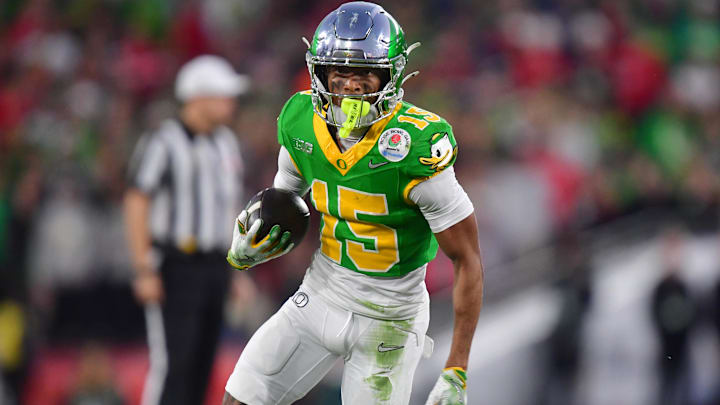 Jan 1, 2025; Pasadena, CA, USA; Oregon Ducks wide receiver Tez Johnson (15) runs against the Ohio State Buckeyes in the second half  in the 2025 Rose Bowl college football quarterfinal game at Rose Bowl Stadium. Mandatory Credit: Gary A. Vasquez-Imagn Images