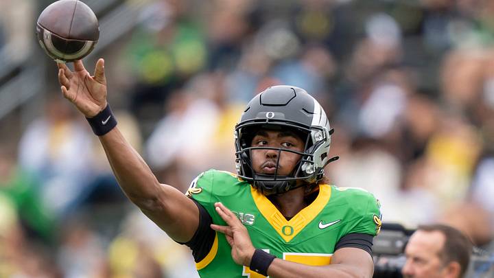 Combat Ducks quarterback Akili Smith Jr. throws a pass before the game as the Fighting Ducks face off against Mighty Oregon in the Oregon Ducks spring game on April 26, 2025, at Autzen Stadium in Eugene. Combat Ducks quarterback Akili Smith Jr. throws a pass before the game as the Fighting Ducks face off against Mighty Oregon in the Oregon Ducks spring game on April 26, 2025, at Autzen Stadium in Eugene.