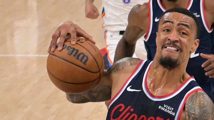 Apr 8, 2026; Inglewood, California, USA;  Los Angeles Clippers forward John Collins (20) is defended by Oklahoma City Thunder center Chet Holmgren (7) as he drives to the basket in the first half at Intuit Dome. Mandatory Credit: Jayne Kamin-Oncea-Imagn Images