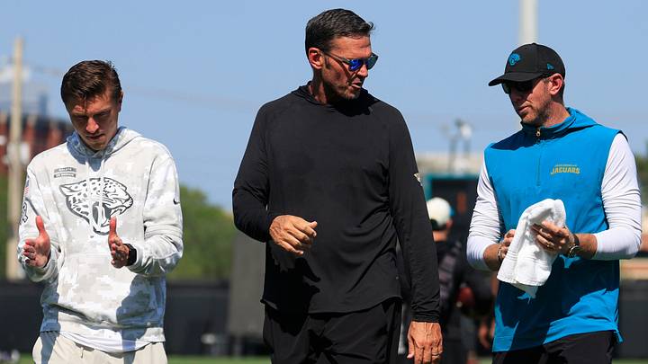From left, Jacksonville Jaguars general manager James Gladstone, Executive Vice President of football operations Tony Boselli, head coach Liam Coen talk after Day 15 of NFL training camp at the Miller Electric Center on Tuesday, Aug. 18, 2026, in Jacksonville, Fla. From left, Jacksonville Jaguars general manager James Gladstone, Executive Vice President of football operations Tony Boselli, head coach Liam Coen talk after Day 15 of NFL training camp at the Miller Electric Center on Tuesday, Aug. 18, 2026, in Jacksonville, Fla.