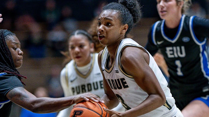 Purdue sophomore Nya Smith (3) protects the ball in the lane during the NCAA women’s basketball game.