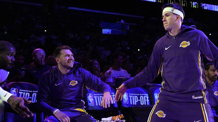 Los Angeles Lakers guard Luka Doncic (left) and guard Austin Reaves (15)