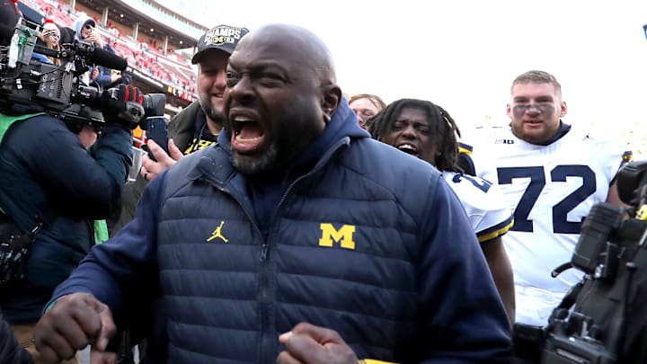 Michigan Wolverines coach Tony Alford celebrates reacts to fans heckling him after the game against the Ohio State Buckeyes at Ohio Stadium.