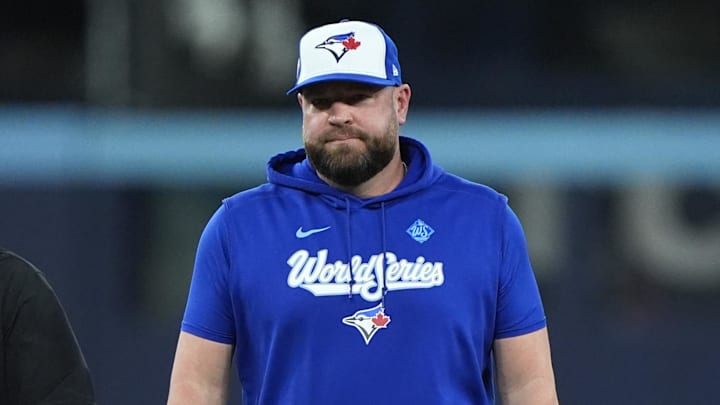 Nov 1, 2025; Toronto, Ontario, CAN; Toronto Blue Jays manager John Schneider (14) reacts after the benches clear in the fourth inning against the Los Angeles Dodgers during game seven of the 2025 MLB World Series at Rogers Centre. 