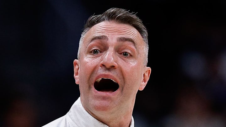 Toronto Raptors head coach Darko Rajakovic gestures in the third quarter against the Denver Nuggets.