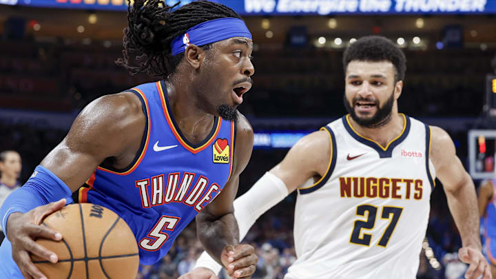 Jan 31, 2024; Oklahoma City, Oklahoma, USA; Oklahoma City Thunder guard Luguentz Dort (5) drives to the basket against Denver Nuggets guard Jamal Murray (27) during the second half at Paycom Center. Mandatory Credit: Alonzo Adams-Imagn Images Jan 31, 2024; Oklahoma City, Oklahoma, USA; Oklahoma City Thunder guard Luguentz Dort (5) drives to the basket against Denver Nuggets guard Jamal Murray (27) during the second half at Paycom Center. Mandatory Credit: Alonzo Adams-Imagn Images