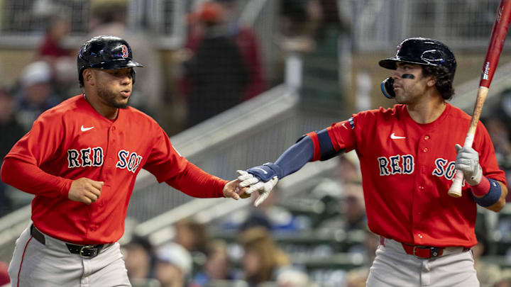 Apr 13, 2026; Minneapolis, Minnesota, USA; Boston Red Sox first baseman Willson Contreras (40) shakes hands with second baseman Marcelo Mayer (11) after scoring a run against the Minnesota Twins in the sixth inning at Target Field. Mandatory Credit: Jesse Johnson-Imagn Images