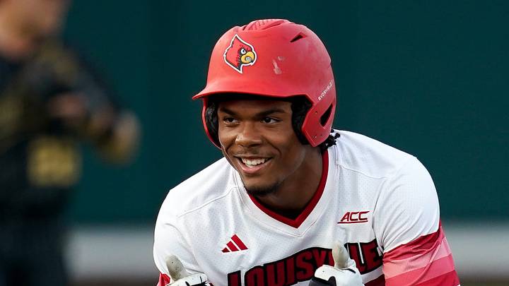Louisville designated hitter Zion Rose (32) smiles