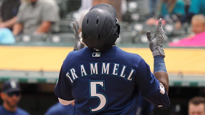 May 4, 2023; Oakland, California, USA; Seattle Mariners left fielder Taylor Trammell (5) gestures at home plate after hitting a two-run home run against the Oakland Athletics during the third inning at Oakland-Alameda County Coliseum
