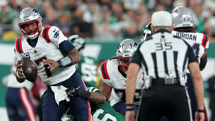Sep 19, 2024; East Rutherford, New Jersey, USA; New York Jets safety Chuck Clark (36) sacks New England Patriots quarterback Jacoby Brissett (7) during the second quarter at MetLife Stadium. Mandatory Credit: Brad Penner-Imagn Images