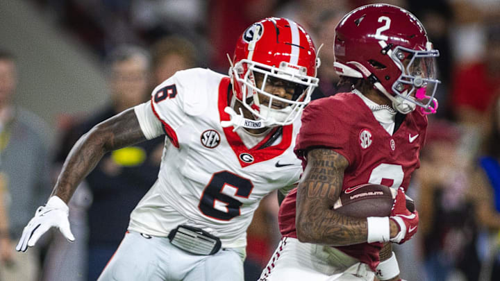 Sep 28, 2024; Tuscaloosa, Alabama, USA; Georgia Bulldogs defensive back Daylen Everette (6) pursues Alabama Crimson Tide wide receiver Ryan Williams (2) during the first quarter at Bryant-Denny Stadium. 