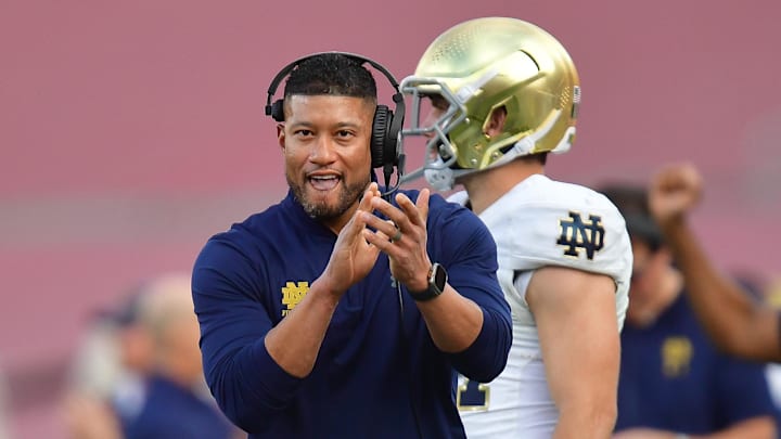 Nov 30, 2024; Los Angeles, California, USA; Notre Dame Fighting Irish head coach Marcus Freeman reacts after cornerback Christian Gray (29) blocks a pass against the Southern California Trojans  during the second half at the Los Angeles Memorial Coliseum. 