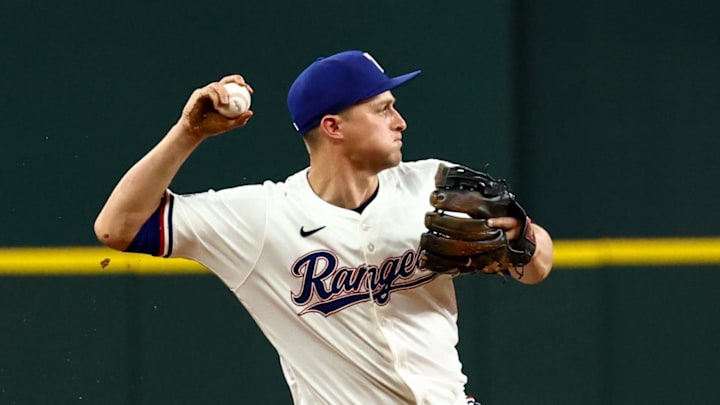 Aug 5, 2025; Arlington, Texas, USA;  Texas Rangers shortstop Corey Seager (5) makes a diving stop to start a double play during the ninth inning against the New York Yankees at Globe Life Field. 