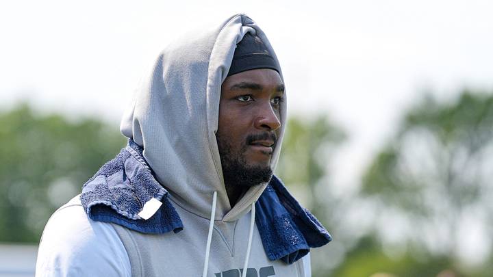 Detroit Lions defensive end Derrick Moore (9) walks off the field after practice during training camp Detroit Lions defensive end Derrick Moore (9) walks off the field after practice during training camp