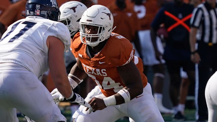 Texas Longhorns defensive lineman Jaray Bledsoe (94) rushes during the second half against the Rice Owls at Darrell K Royal-Texas Memorial Stadium.