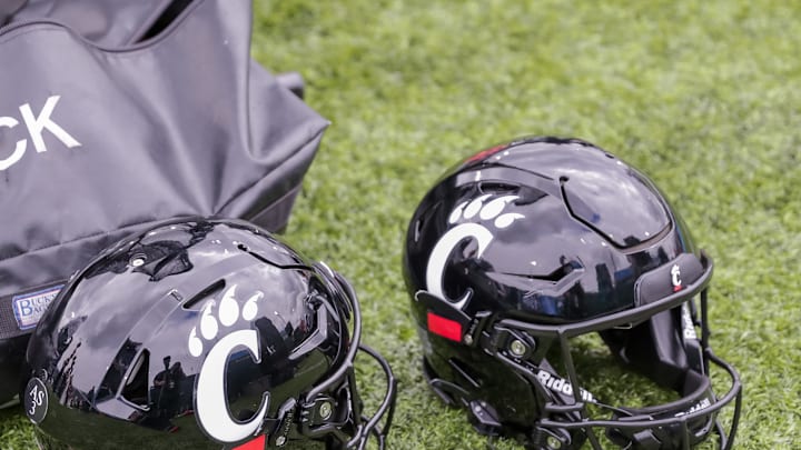 Oct 30, 2021; New Orleans, Louisiana, USA; Cincinnati Bearcats helmets on the ground during the game against Tulane Green Wave during the second half at Yulman Stadium. Mandatory Credit: Stephen Lew-Imagn Images Oct 30, 2021; New Orleans, Louisiana, USA; Cincinnati Bearcats helmets on the ground during the game against Tulane Green Wave during the second half at Yulman Stadium. Mandatory Credit: Stephen Lew-Imagn Images