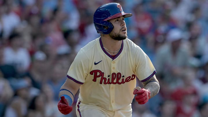 Jun 22, 2024; Philadelphia, Pennsylvania, USA;  Philadelphia Phillies catcher Rafael Marchan (13) hits a double in the seventh inning against the Arizona Diamondbacks at Citizens Bank Park. The Phillies won 12-1