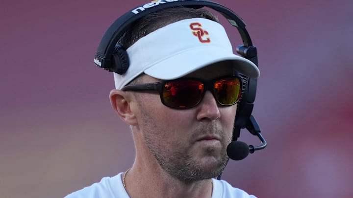 Oct 21, 2023; Los Angeles, California, USA; Southern California Trojans head coach Lincoln Riley watches from the sidelines against the Utah Utes in the first half at United Airlines Field at Los Angeles Memorial Coliseum. Mandatory Credit: Kirby Lee-Imagn Images Oct 21, 2023; Los Angeles, California, USA; Southern California Trojans head coach Lincoln Riley watches from the sidelines against the Utah Utes in the first half at United Airlines Field at Los Angeles Memorial Coliseum. Mandatory Credit: Kirby Lee-Imagn Images