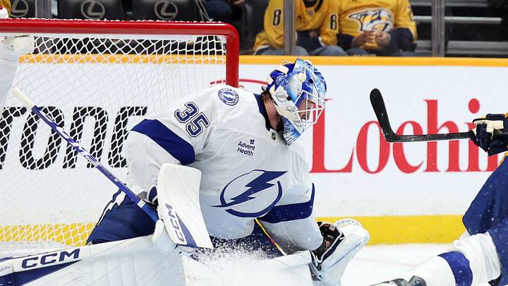 Sep 22, 2026; Nashville, Tennessee, USA;  Nashville Predators right wing Matthew Wood (71) attacks as Tampa Bay Lightning goaltender Dennis Hildeby (35) and defenseman Tomas Kralovic (82) defend during the first period at Bridgestone Arena.  Mandatory Credit: Alan Poizner-Imagn Images