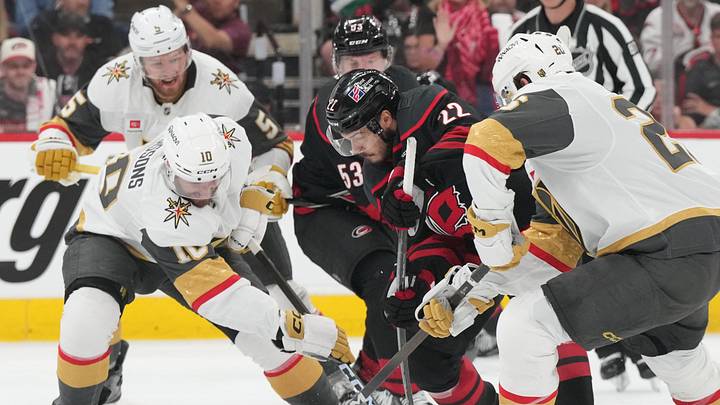 Jun 2, 2026; Raleigh, North Carolina, USA; Carolina Hurricanes right wing Jackson Blake (53) is defended by Vegas Golden Knights center Colton Sissons (10) and left wing Brandon Saad (20) during the third period in game one of the 2026 Stanley Cup Final at Lenovo Center. Mandatory Credit: James Guillory-Imagn Images