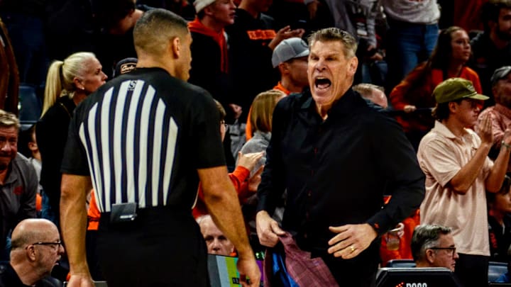 Oklahoma coach Porter Moser argues with an official against Oklahoma State.