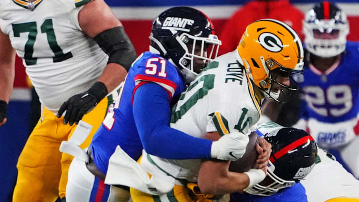 New York Giants defender Azeez Ojulari (51) sacks Green Bay Packers quarterback Jordan Love in 2023.
