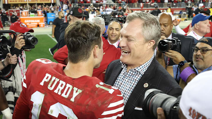 San Francisco 49ers quarterback Brock Purdy (L) and general manager John Lynch (R)
