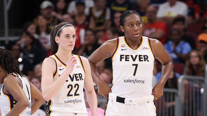 Indiana Fever players Caitlin Clark and Aliyah Boston look on during a WNBA game. Indiana Fever players Caitlin Clark and Aliyah Boston look on during a WNBA game.