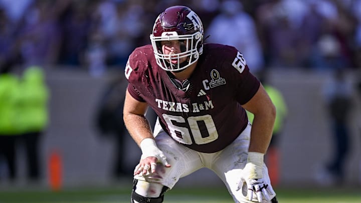 Dec 20, 2025; College Station, TX, USA; Texas A&M Aggies offensive lineman Trey Zuhn III (60) lines up during the game between the Aggies and the Hurricanes at Kyle Field. 