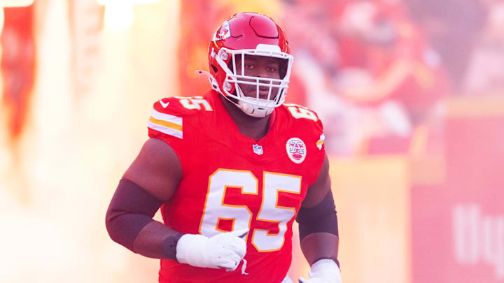 Kansas City Chiefs guard Trey Smith runs out of the tunnel before a game.