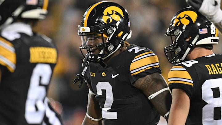 Nov 18, 2023; Iowa City, Iowa, USA; Iowa Hawkeyes running back Kaleb Johnson (2) reacts with wide receiver Nico Ragaini (89) during the fourth quarter against the Illinois Fighting Illini at Kinnick Stadium. Mandatory Credit: Jeffrey Becker-Imagn Images Nov 18, 2023; Iowa City, Iowa, USA; Iowa Hawkeyes running back Kaleb Johnson (2) reacts with wide receiver Nico Ragaini (89) during the fourth quarter against the Illinois Fighting Illini at Kinnick Stadium. Mandatory Credit: Jeffrey Becker-Imagn Images