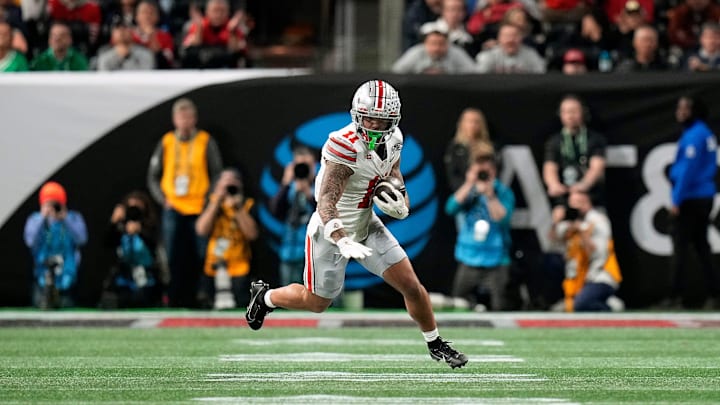 Ohio State Buckeyes wide receiver Brandon Inniss (11) heads up field after a catch against Notre Dame Fighting Irish in the second quarter during the College Football Playoff championship at Mercedes-Benz Stadium in Atlanta on January 20, 2025.