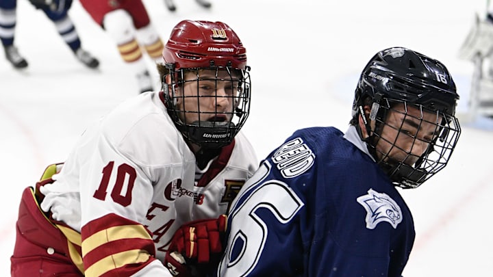 Feb 28, 2025; Chestnut Hill, MA, USA; Boston College forward James Hagens (10) skates against New Hampshire defenseman Luke Reid (16) during the first period at Conte Forum. 