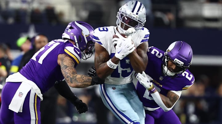 Dec 14, 2025; Arlington, Texas, USA; Minnesota Vikings linebacker Blake Cashman (51) and cornerback Isaiah Rodgers (2) tackle Dallas Cowboys wide receiver Ryan Flournoy (19) during the first half at AT&T Stadium. Dec 14, 2025; Arlington, Texas, USA; Minnesota Vikings linebacker Blake Cashman (51) and cornerback Isaiah Rodgers (2) tackle Dallas Cowboys wide receiver Ryan Flournoy (19) during the first half at AT&T Stadium.