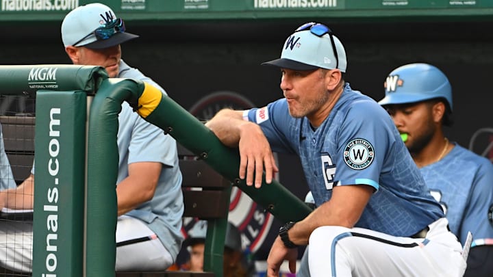 Washington Nationals coach kneeling at dugout entry Washington Nationals coach kneeling at dugout entry