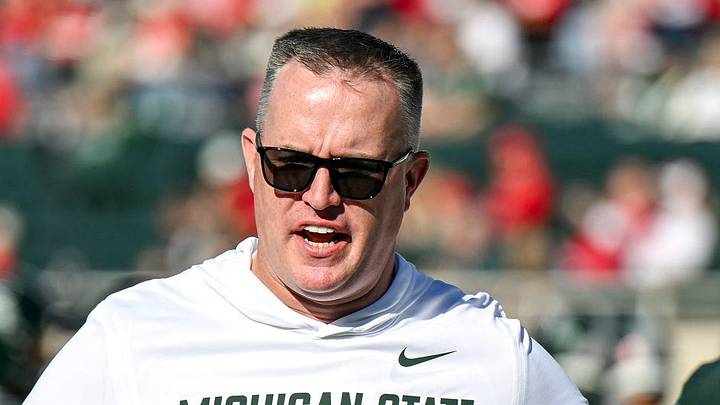 Michigan State’s head coach Pat Fitzgerald, center, talks with Jaziun Patterson, left, and Marvis Parrish before the football game against Nebraska on Saturday, Sept. 26, 2026, in East Lansing.