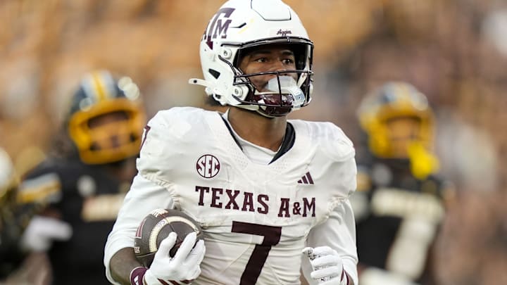 Nov 8, 2025; Columbia, Missouri, USA; Texas A&M Aggies wide receiver KC Concepcion (7) runs for a touchdown during the second half against the Missouri Tigers at Faurot Field at Memorial Stadium. Mandatory Credit: Jay Biggerstaff-Imagn Images]